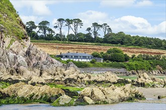 House over River Emme and Red Cove, Mothecombe, Plymouth, South Devon, England, United Kingdom,