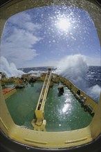 Bullseye with sunb look to bow of Icebreaker Kapitan Khlebnikov in rough seas at the way to