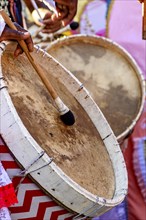 Rustic and colorful wooden drums at an Afro-Brazilian cultural event on the streets of Brazil, Belo