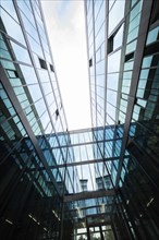 Modern building with glass façade and reflective sky, University of Stuttgart, Germany, Europe