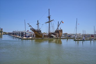 Historic sailing ship moored in a harbour on a sunny day on blue water, St Augustine, harbour,