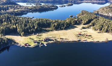 Farm with red houses on an island near Risor, aerial view, norwegean southern coast, Norway, Europe