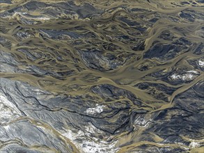 Aerial view, glaicial streams flow across Mælifellssandur, black sand desert, Icelandic highlands,