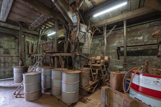 Metal barrels in the bronze powder filling room of a metal powder mill, founded in 1900, Igensdorf,