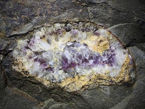 Minerals in the rock of the visitor gallery of the Steinkaulenberg gemstone mines, show mine in