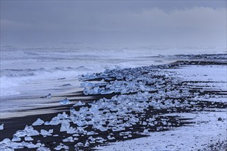 Ice floes on the beach, snowy, waves, sea, clouds, winter, Diamond Beach, Breidamerkursandur,