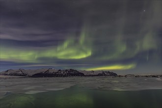 Northern Lights, Aurora borealis over glaciers and Jökulsarlon, Vatnajökull, Iceland, Europe