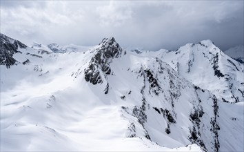 Snow-covered mountain landscape, Wildhorn peak in the background, dramatic clouds, Bernese Alps,