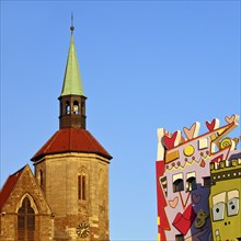 Magnikirche next to the Happy Rizzi House by the artist James Rizzi, architectural contrast,