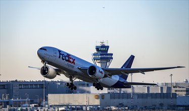 FedEx cargo aircraft, Boeing 777-FS2, taking off at Cologne-Bonn Airport, North Rhine-Westphalia,