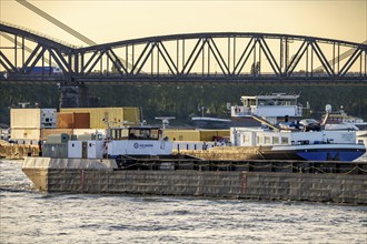 Cargo ships on the Rhine at Duisburg-Baerl, behind the Haus-Knipp railway bridge and the motorway