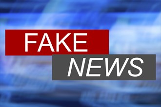 Symbolic image of fake news: The screen of an imaginary news programme shows the words fake news