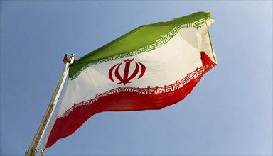 Flag, the national flag of Iran flutters in the wind