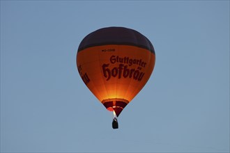 A hot air balloon from Stuttgarter Hofbräu takes to the skies in the morning, Stuttgart,