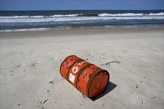 Washed up oil drum on the beach, Loango National Park, Parc National de Loango, Ogooué-Maritime