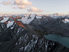 Evening mood, mountain panorama, aerial view, 4000 metre peak with glacier, mountain pass and