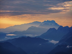 Silhouette of the Hoher Dachstein in the haze at dawn, Roßfeld, Golling, Salzburg province,