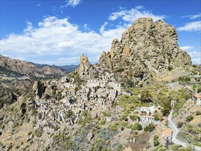 Mountains and Olive groves around Ghost Town from a drone, Pentedattilo Village, Calabria, Italy,