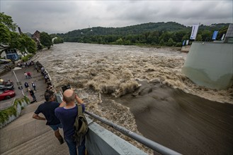 Weir of the Lake Baldeney in Essen, the masses of water roar through the open weirs, high water on