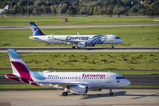 Düsseldorf Airport, Egyptair Airbus A321neo on take-off, Eurowings Airbus A319 on the taxiway