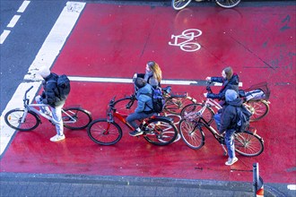 Cycle lane, space for cyclists at a traffic light crossing, marked red, cars, lorries must stop