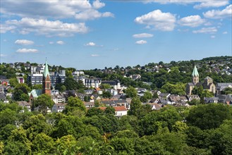 City panorama with Protestant church, left, St. Ludgerus Church, Essen-Werden, in the south of the