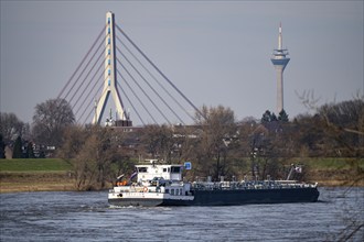 Cargo ship on the Rhine near Dormagen, in the background the Fleher Bridge and the Rhine Tower in