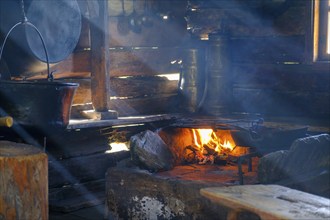 Stube with smoke and fire, South Tyrolean Folklore Museum, Dietenheim, Freilchtmuseum, Pustertal,