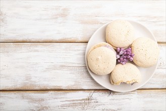 Meringues cakes on a white wooden background. Top view, flat lay, copy space