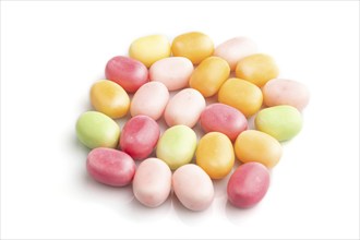 Heap of multicolored caramel candies isolated on white background. close up, side view