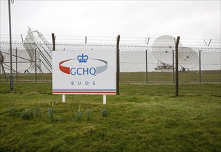 Satellite receiver dishes and sign for GCHQ facility near Bude, Cornwall