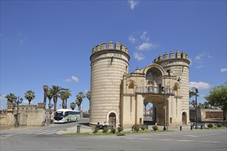 Historic archway with two towers built in 1551 at the Puerta de Palmas bridge and coach, Badajoz,