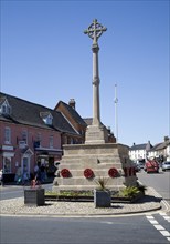 War memorial and historic buildings in the town of Holt, north Norfolk, England, United Kingdom,