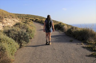 Woman walking Rodalquilar, Cabo de Gata natural park, Almeria, Spain, Europe