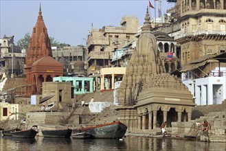 Ghat and rowing boats on the Ganges river at Varanasi, Uttar Pradesh, India, Asia