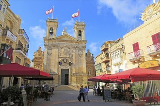 Basilica church and cafes in Saint George's square, Plaza San Gorg, Victoria Rabat, island of Gozo,