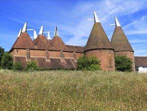 Historic oast house buildings at Sissinghurst castle gardens, Kent, England, UK