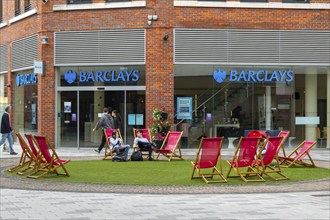 Pedestrianised area with deckchairs outside Barclays bank, Parkway shopping centre, Newbury,