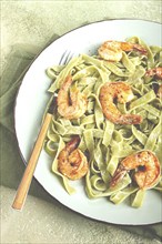 Tagliatelle with spinach, in cream sauce, with shrimp, homemade, no people