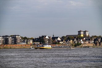 Cargo ships on the Rhine near Rees, Church of the Assumption of the Virgin Mary North