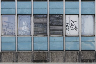 Broken windows and shutters of an abandoned office building loom in Berlin, 29/02/2024