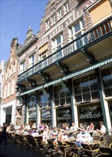 People sitting outside cafe, Haarlem, Holland