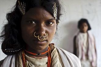 Portrait of a teenage girl from the Dongria kondh tribe, Odisha, India. Various ways of writing :