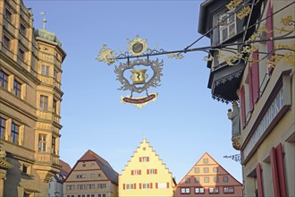 Renaissance town hall and half-timbered house Marien-Apotheke with nose sign on the market square,