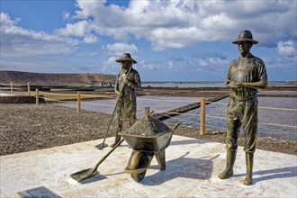 Sculptures of salt workers, sea salt extraction, Janubio salt flats, Salinas de Janubio, Lanzarote,