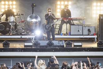 Samuel Sam Fogarino (drummer), Paul Banks (singer) and Brandon Curtis (keyboarder) of the band