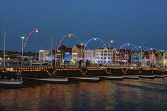 View at dusk of Queen Emma Bridge Queen Emma Bridge swing bridge Emma-Brug floating bridge with 16