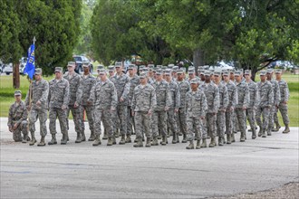 Flight of airmen marching in formation during United States Air Force basic training graduation