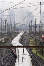 Railway tracks with regional and long-distance trains, ICE, after freezing rain, in front of