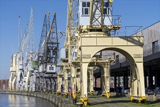 Harbour cranes on the Scheldekai, the world's largest collection of historic cranes, are part of